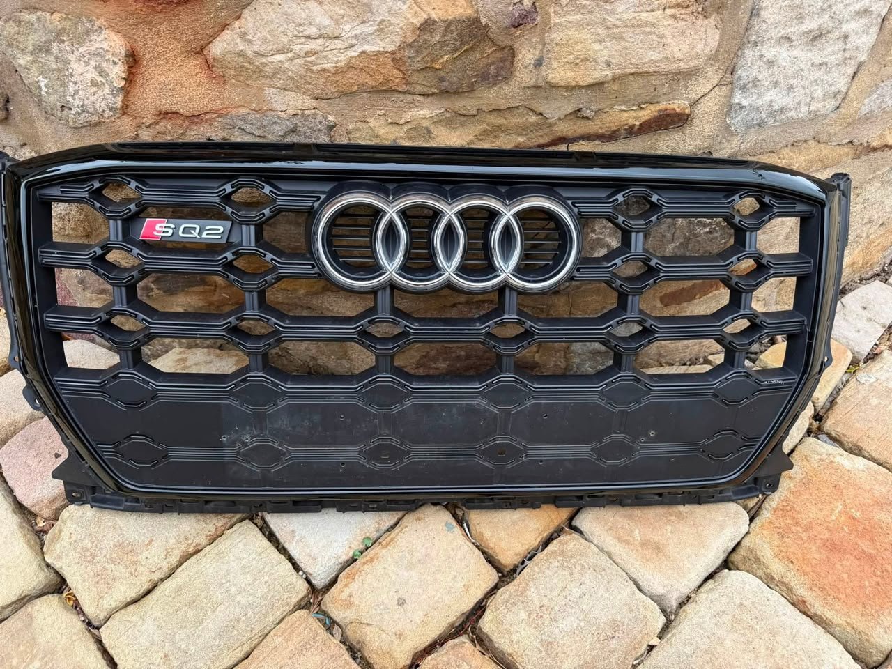 2021 Audi SQ2 Front Grille – Gloss Black Honeycomb Style with SQ2 Badge _ Audi Flagship Store 2021 Audi SQ2 Front Grille – Gloss Black Honeycomb Style with SQ2 Badge | Audi Flagship Store - Image 1